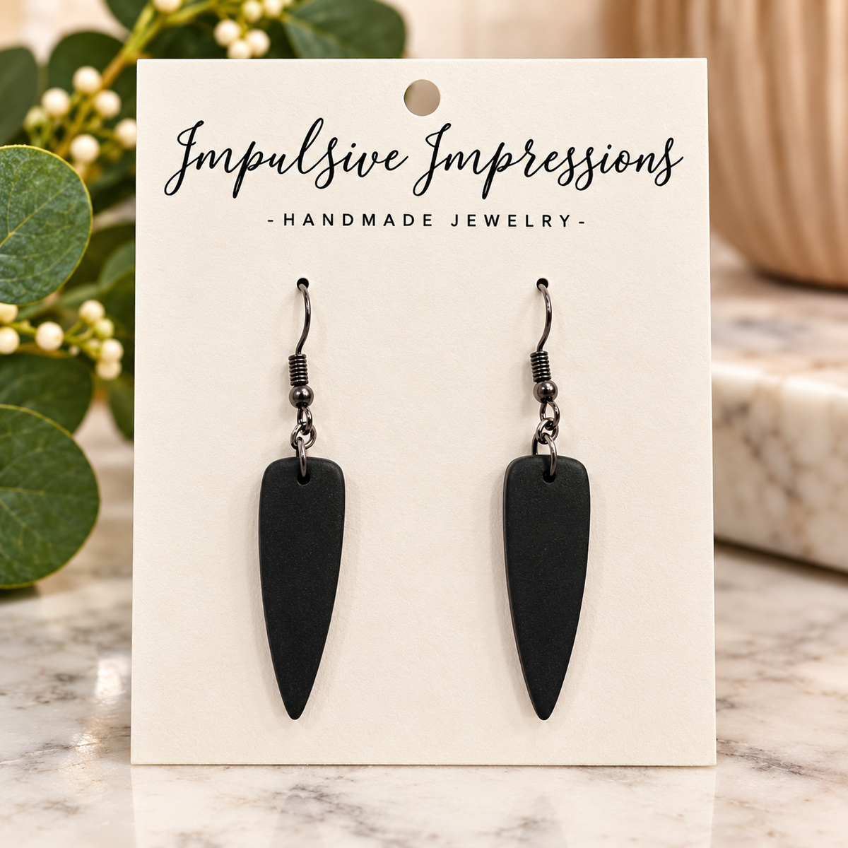 Matte black tapered polymer clay drop earrings with gunmetal hooks