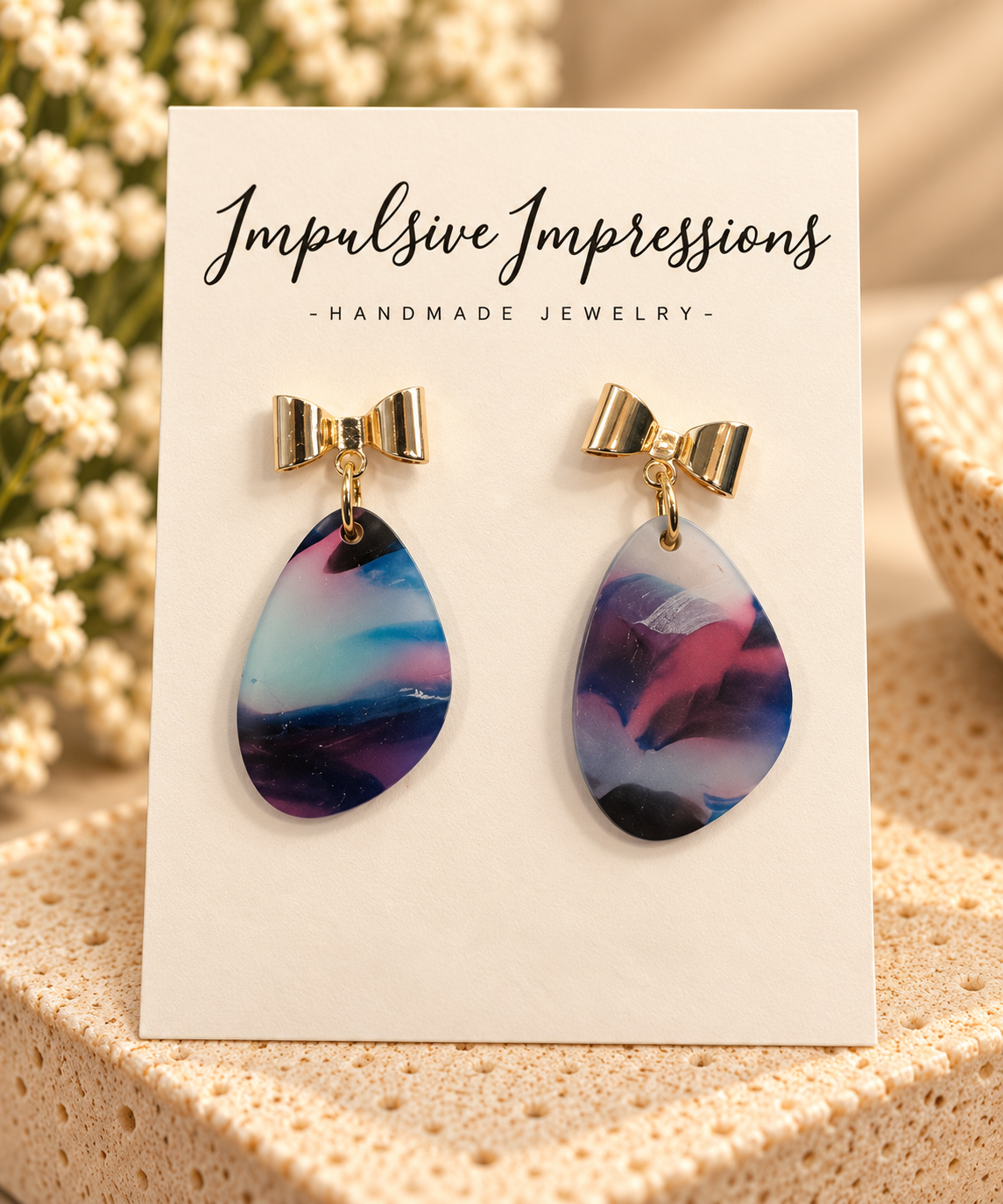 Gold bow stud earrings with multicolor marbled polymer clay teardrop charms
