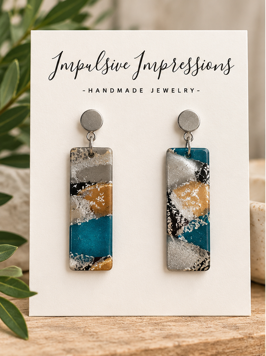 SKU 53 abstract teal and gold polymer clay earrings styled product photo