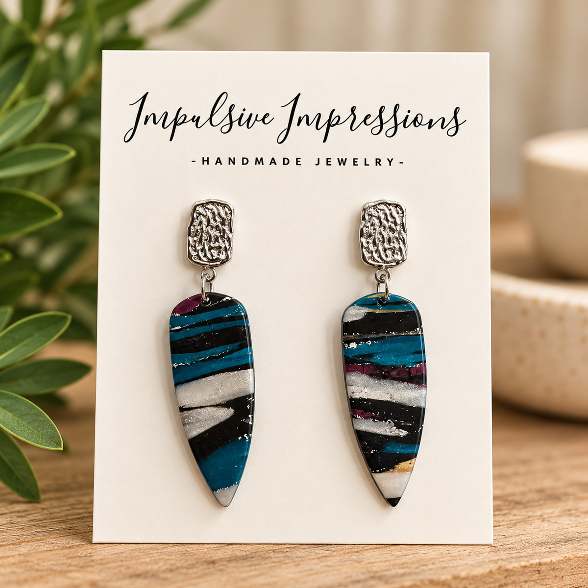 SKU 56 teal and black striped pointed polymer clay earrings