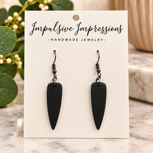 Matte black tapered polymer clay drop earrings with gunmetal hooks