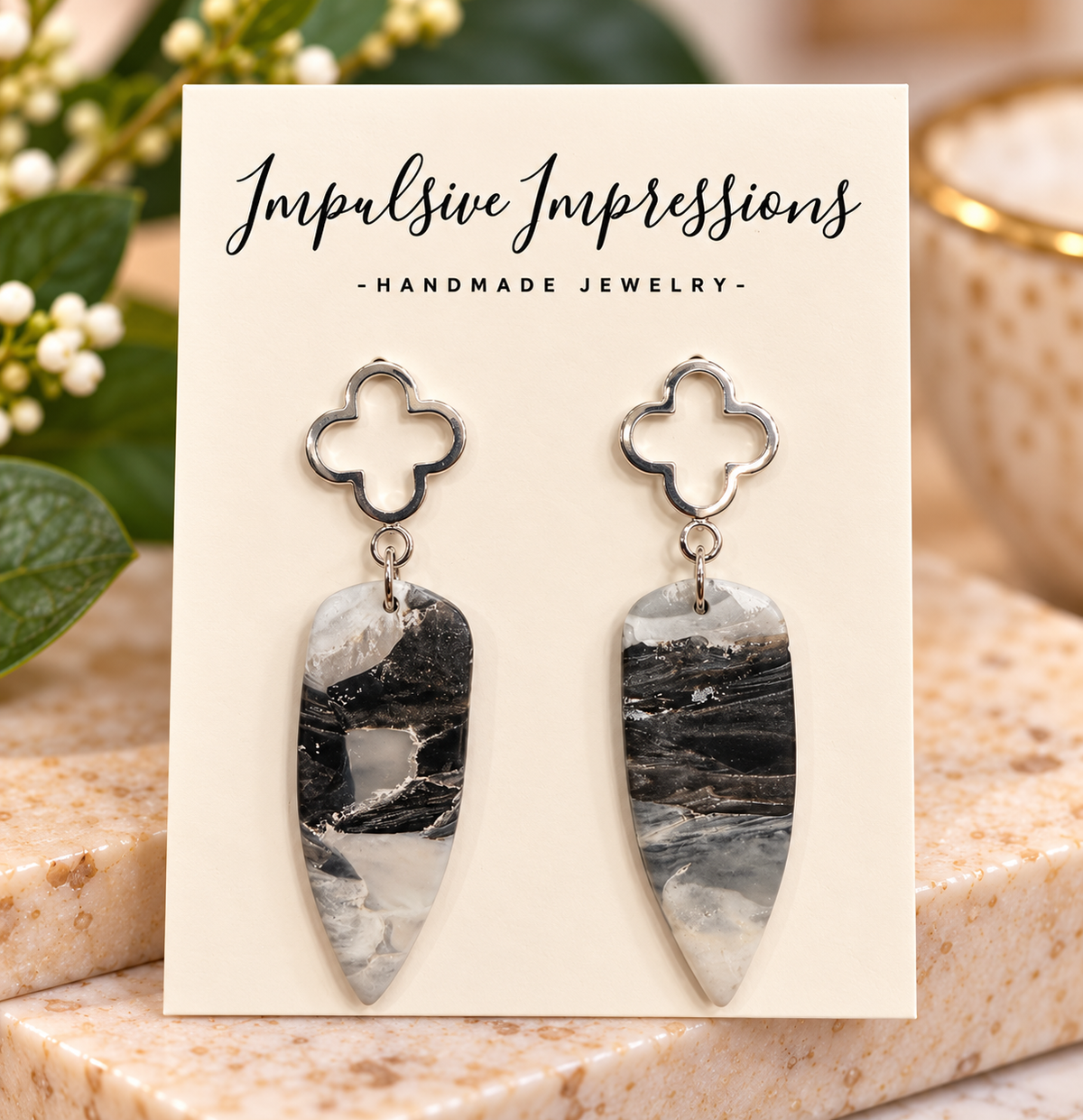 Black white and gray marbled polymer clay drops with silver quatrefoil tops