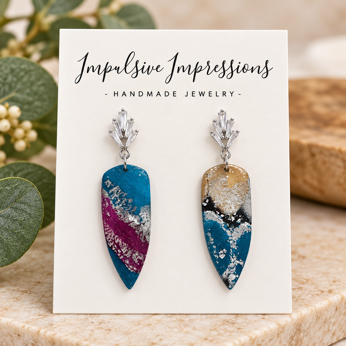 Teal and plum polymer clay earrings with silver crystal tops