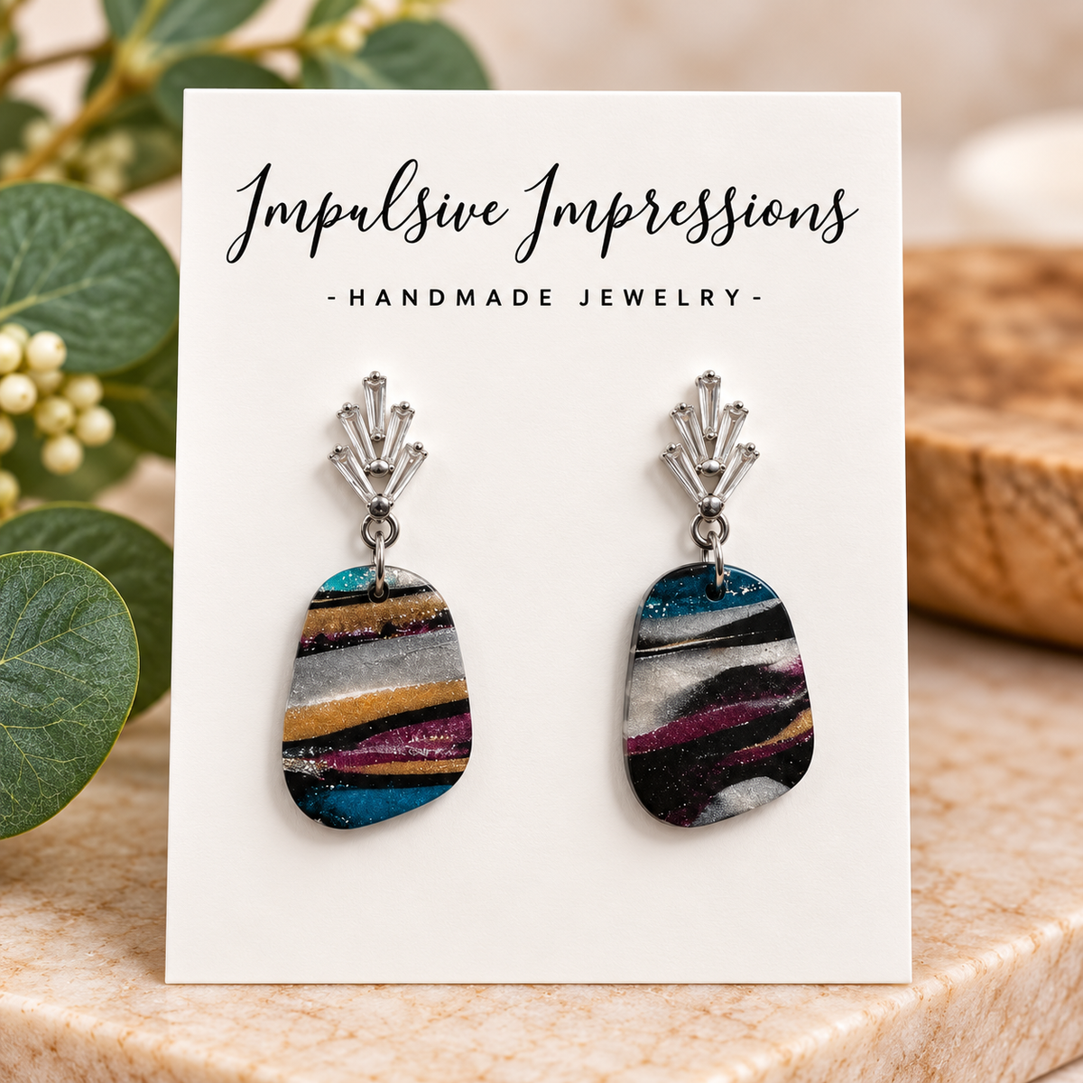 Silver crystal fan and multicolor striped polymer clay earrings