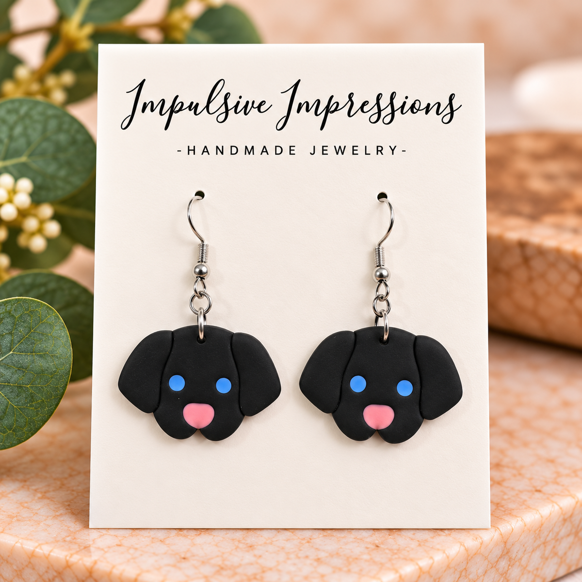 Black puppy face polymer clay earrings