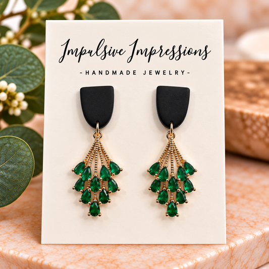 Black polymer clay studs with gold-tone cascading emerald green teardrop chandelier charms