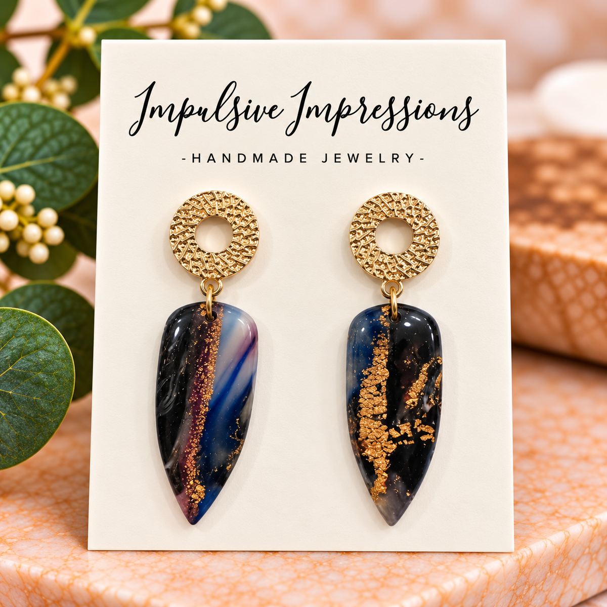Navy black and gold marbled polymer clay earrings with textured gold circle studs