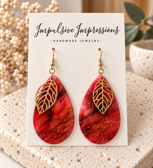 Red pink marbled polymer clay teardrop earrings with gold-tone leaf charms