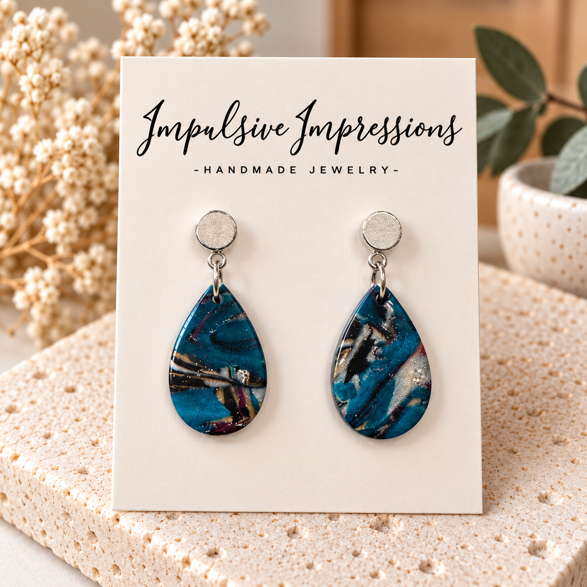 Small teal blue marbled polymer clay teardrop earrings with silver-tone studs