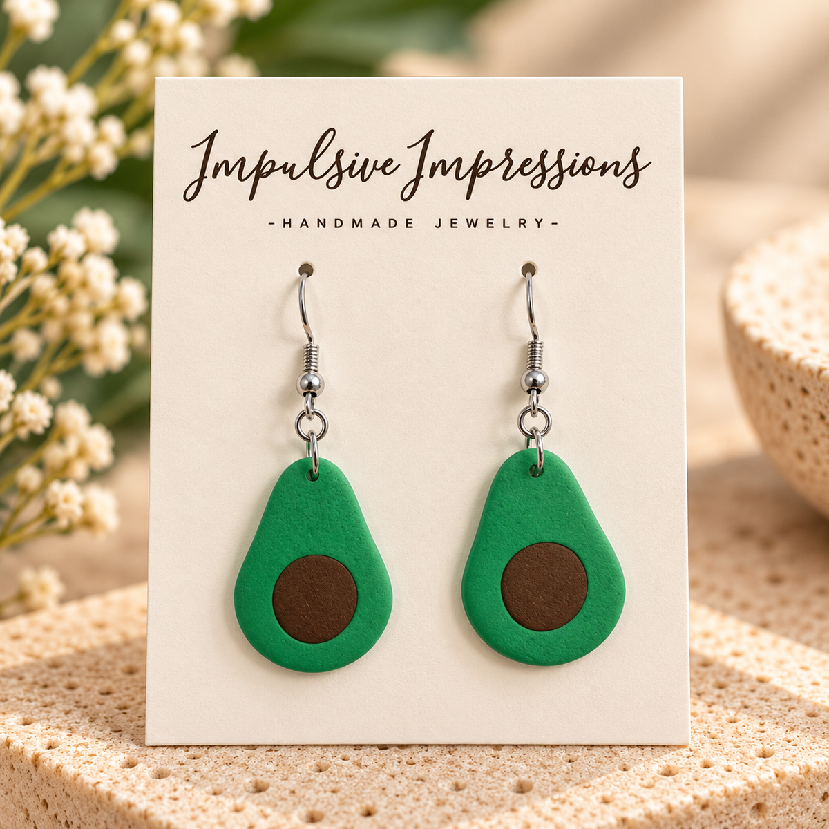 Handmade green avocado polymer clay earrings with silver-tone fishhook wires