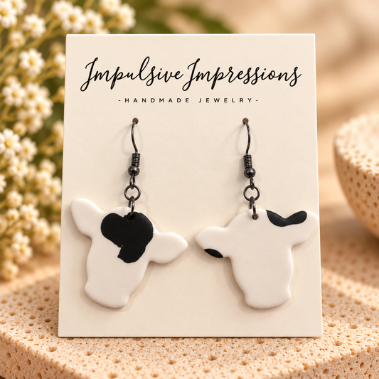 Black and white cow head handmade polymer clay dangle earrings