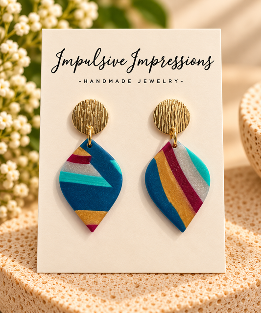 Multicolor striped polymer clay pointed leaf earrings with textured gold-tone studs