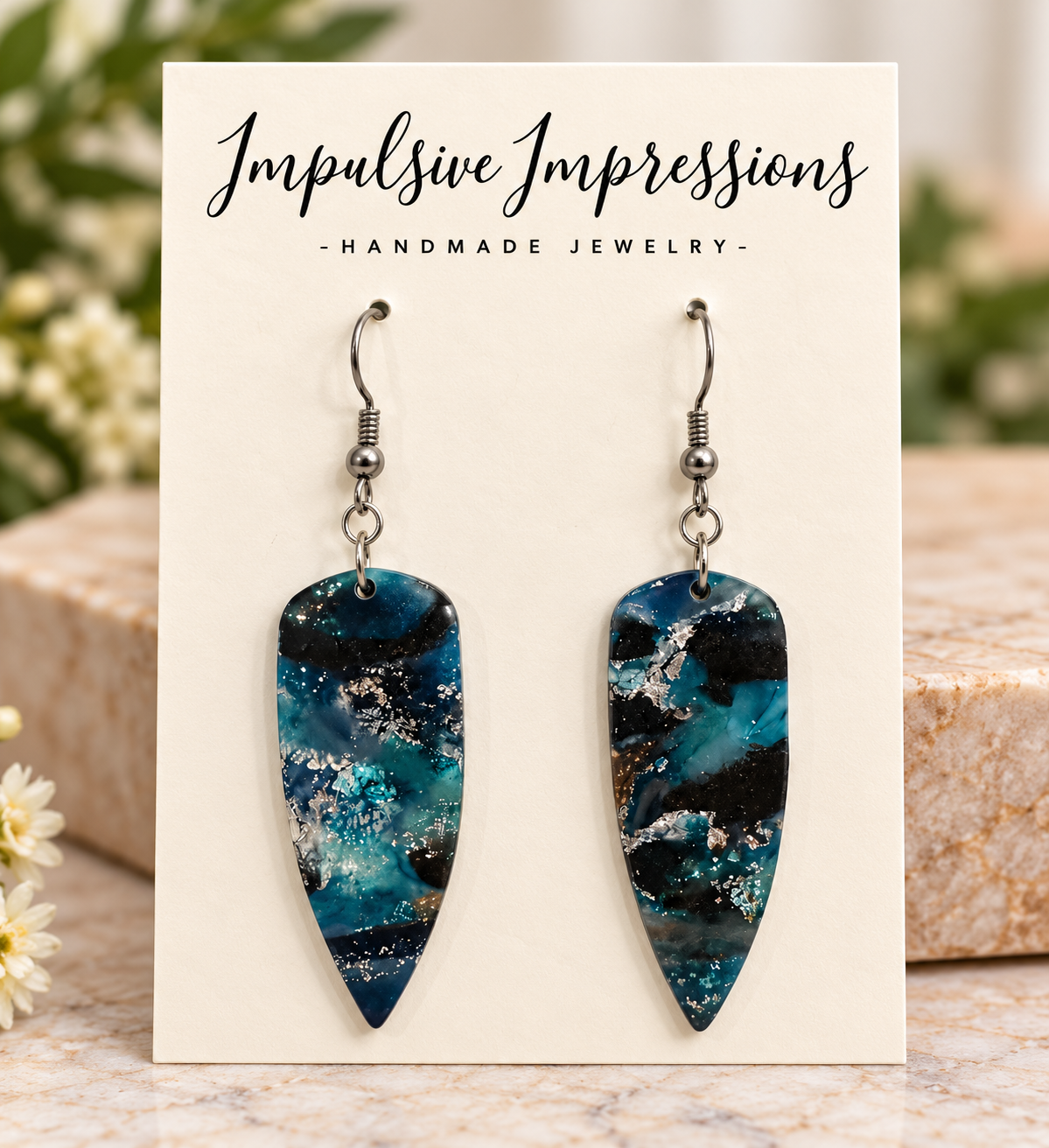 Ocean-inspired teal and navy polymer clay dangle earrings