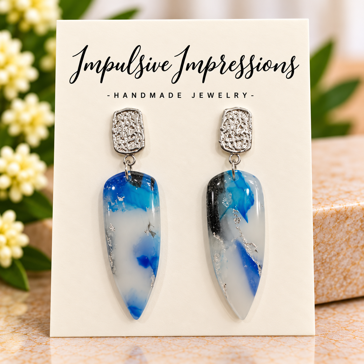 Ocean blue and white marbled polymer clay earrings with silver-tone studs